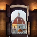 View from the old window on Florence Duomo Basilica di Santa Maria del Fiore.  Florence, Italy. Collage of the historical theme and the theme of travel.