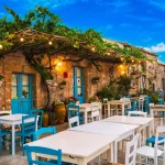 Famous colorful outdoor cafe in the most beautiful sicilian village Marzamemi in Sicily, south Italy