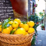 Wicker basket full of lemons on the italian street od Corniglia