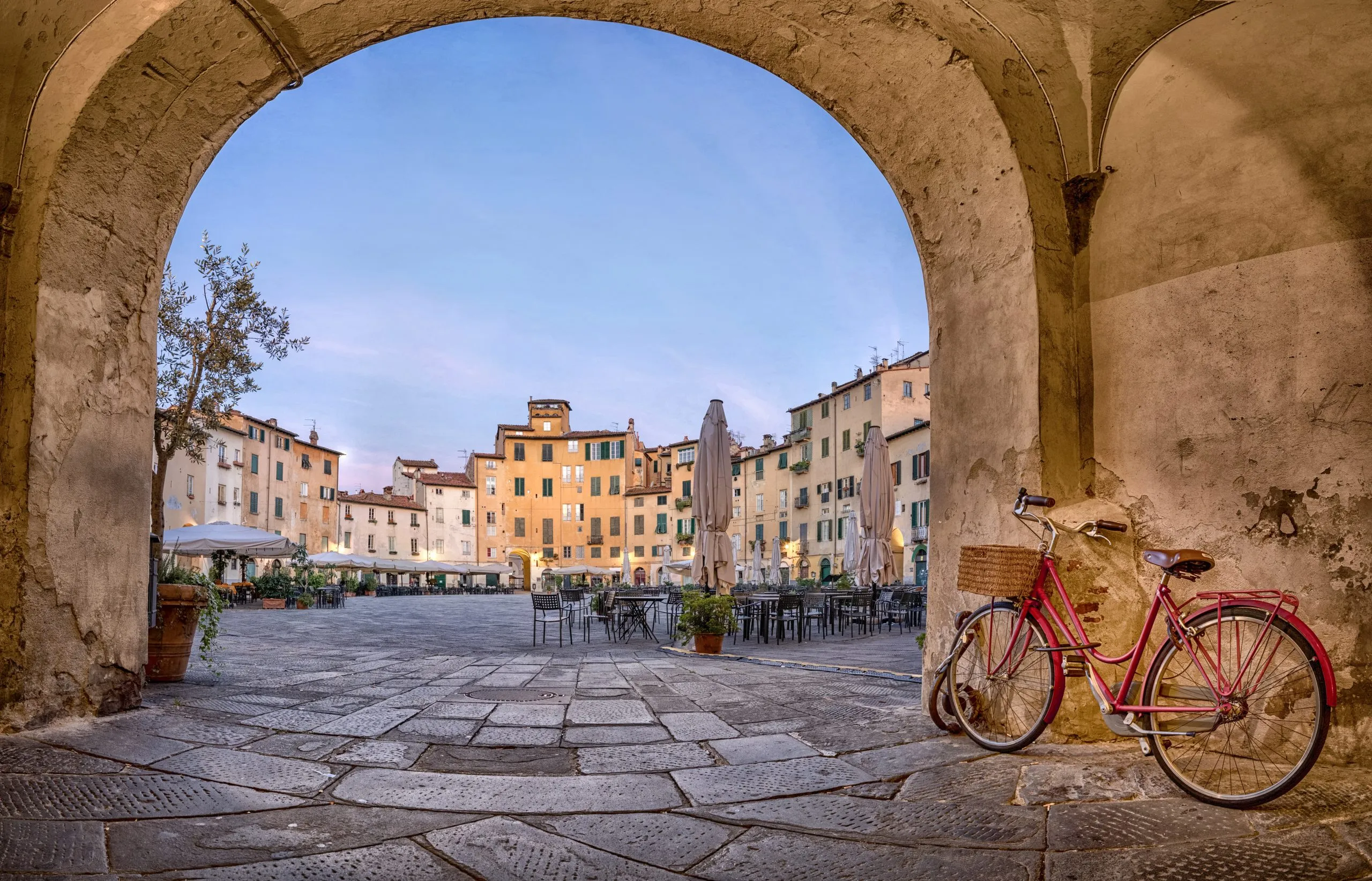 Lucca, Italy. View of Piazza dell'Anfiteatro square through the arch