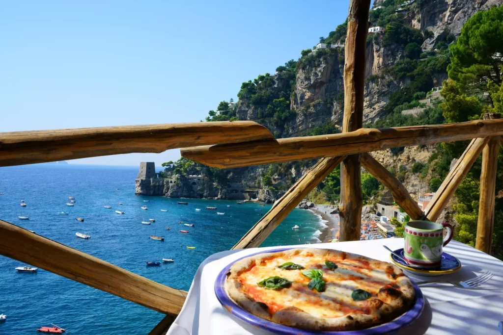 Pizza place terrace overlooking to a beautiful Positano coast, Italy