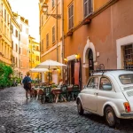 Rome, Italy - May 28, 2017: Cozy street in Trastevere, Rome, Europe. Trastevere is a romantic district of Rome, along the Tiber in Rome. Turistic attraction of Rome.
