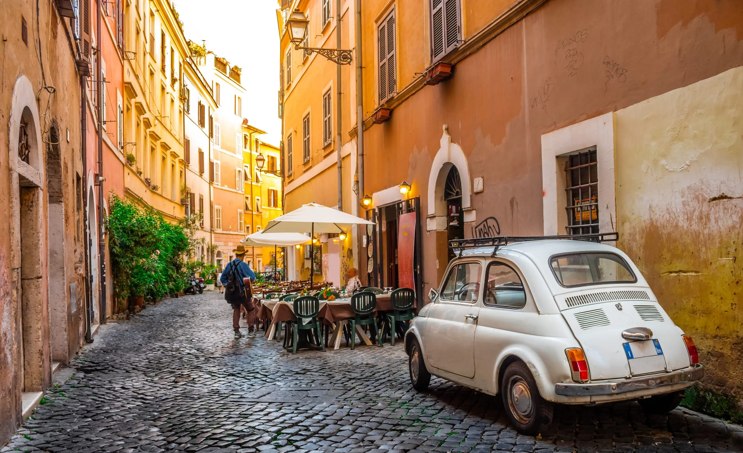 Rome, Italy - May 28, 2017: Cozy street in Trastevere, Rome, Europe. Trastevere is a romantic district of Rome, along the Tiber in Rome. Turistic attraction of Rome.