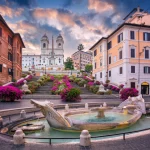 Cityscape image of Spanish Steps and Barcaccia Fountain in Rome, Italy at sunrise.