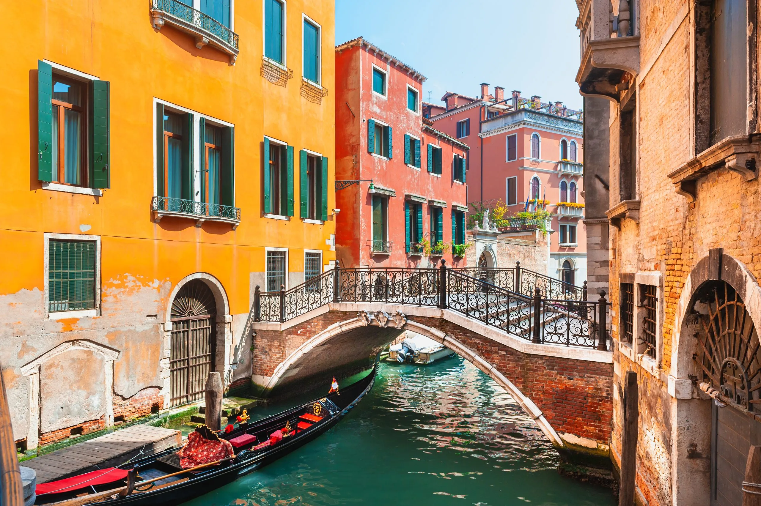 Beautiful canal with old medieval architecture and bridge in Venice, Italy. Famous travel destination